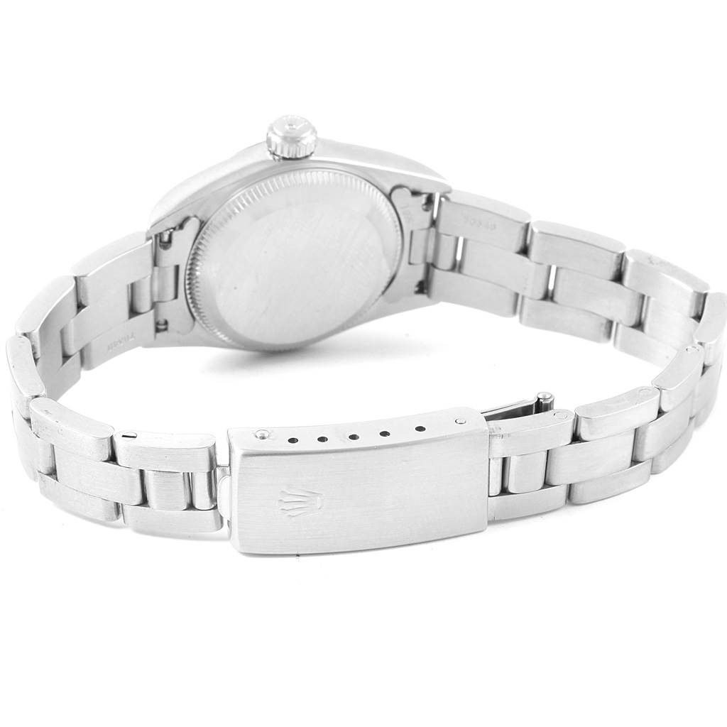 The image shows the back view of a Rolex Oyster Perpetual 67180 Women
s Stainless Steel Pink Dial 67180 Women
s Stainless Steel Pink Dial watch, highlighting its bracelet and clasp.