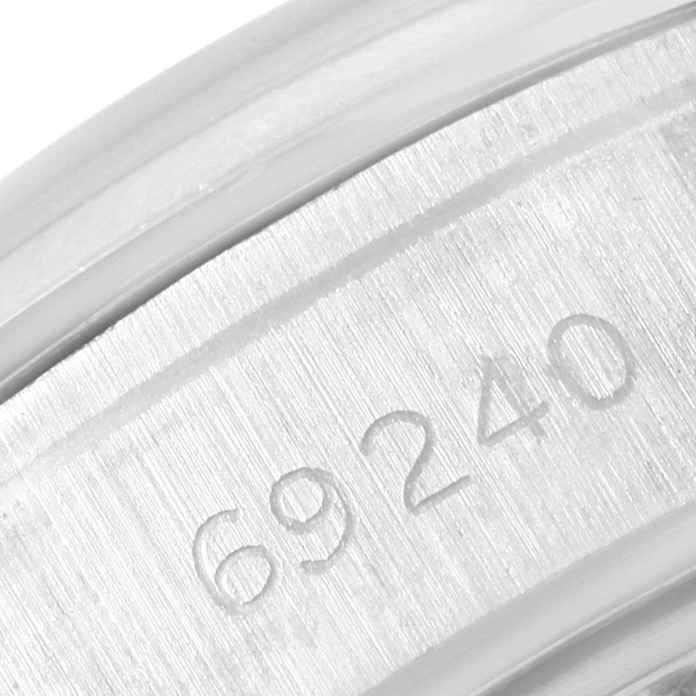 This close-up image shows the model number 69240 engraved on the metal case of a Rolex Oyster Perpetual 79160 Women's Stainless Steel Blue Dial 79160 Women's Stainless Steel Blue Dial watch.