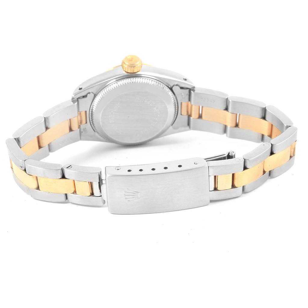 The image shows the back view of the Rolex Oyster Perpetual 67193 Women's Steel and Gold (two tone) Champagne Dial 67193 Women's Steel and Gold (two tone) Champagne Dial watch, focusing on the case and the two-tone metal bracelet with the clasp.