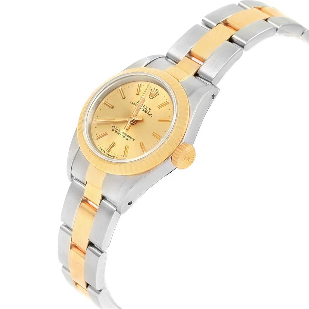 The Rolex Oyster Perpetual 67193 Women's Steel and Gold (two tone) Champagne Dial 67193 Women's Steel and Gold (two tone) Champagne Dial watch is shown at an angle displaying the face, crown, and part of the bracelet.