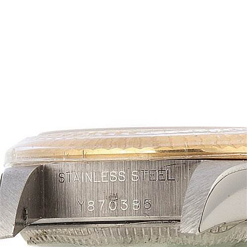 This image shows a side view of the casing for a Rolex Oyster Perpetual 76193 Women's Stainless Steel Silver Dial 76193 Women's Stainless Steel Silver Dial watch, revealing the stainless steel marking and part of the serial number.