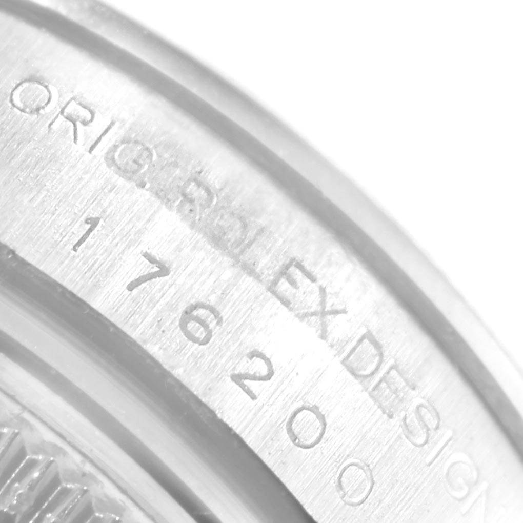 This close-up angle shows the engraved model number and part of the casing of the Rolex Oyster Perpetual 176200 Women
s Stainless Steel Pink Dial 176200 Women
s Stainless Steel Pink Dial watch.