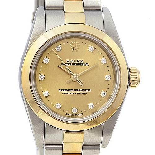 The image shows a frontal view of a Rolex Oyster Perpetual 76183 Women's Stainless Steel Champagne Dial 76183 Women's Stainless Steel Champagne Dial watch, highlighting its gold and silver bracelet and diamond hour markers.