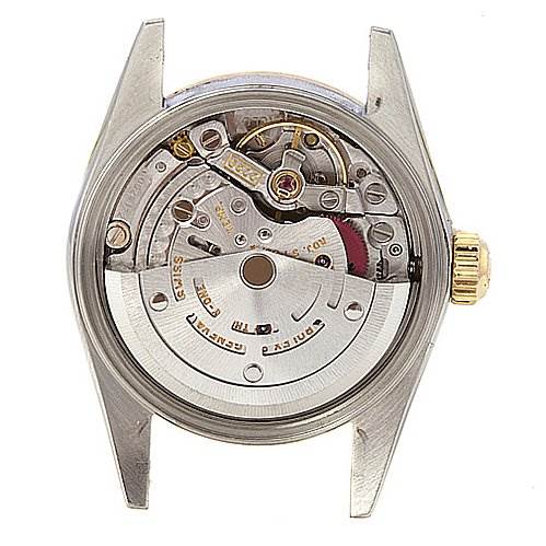 The image shows the inner mechanical movement of the Rolex Oyster Perpetual 76183 Women's Stainless Steel Champagne Dial 76183 Women's Stainless Steel Champagne Dial watch from a rear angle with the case back removed.
