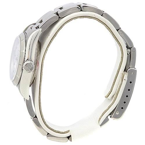 The image shows a side profile of a Rolex Oyster Perpetual 67230 Women's Stainless Steel White Dial 67230 Women's Stainless Steel White Dial watch, highlighting the case, bezel, crown, and bracelet.