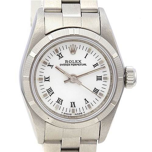 This image shows a front view of a Rolex Oyster Perpetual 67230 Women's Stainless Steel White Dial 67230 Women's Stainless Steel White Dial watch, displaying the face, bezel, crown, and part of the bracelet.