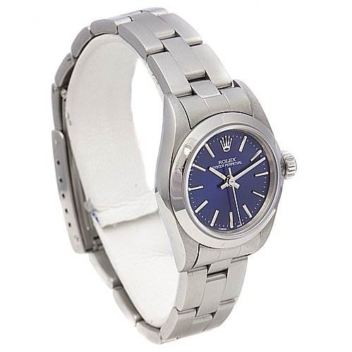 The image shows a Rolex Oyster Perpetual 67180 Women's Stainless Steel Blue Dial 67180 Women's Stainless Steel Blue Dial watch from a front-left angle, highlighting its blue dial, stainless steel case, and bracelet.