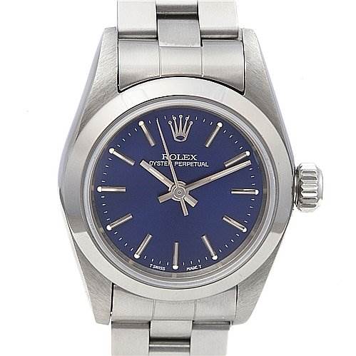 The image shows a front view of the Rolex Oyster Perpetual 67180 Women's Stainless Steel Blue Dial 67180 Women's Stainless Steel Blue Dial watch, displaying its blue dial, hands, hour markers, crown, and a portion of the bracelet.