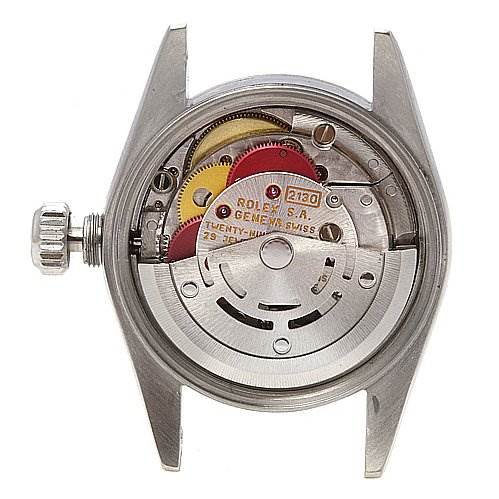 This image shows the back view of the Rolex Oyster Perpetual 67180 Women's Stainless Steel Blue Dial 67180 Women's Stainless Steel Blue Dial watch, revealing its intricate internal movement.