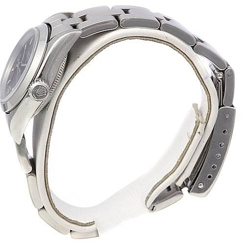 The image shows a side view of a Rolex Oyster Perpetual 67180 Women's Stainless Steel Black Dial 67180 Women's Stainless Steel Black Dial watch, highlighting the bracelet, clasp, and side profile of the case.