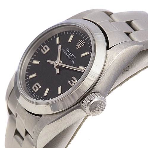 This image shows a Rolex Oyster Perpetual 67180 Women's Stainless Steel Black Dial 67180 Women's Stainless Steel Black Dial watch from a slightly tilted side angle, highlighting the face, bezel, crown, and part of the bracelet.