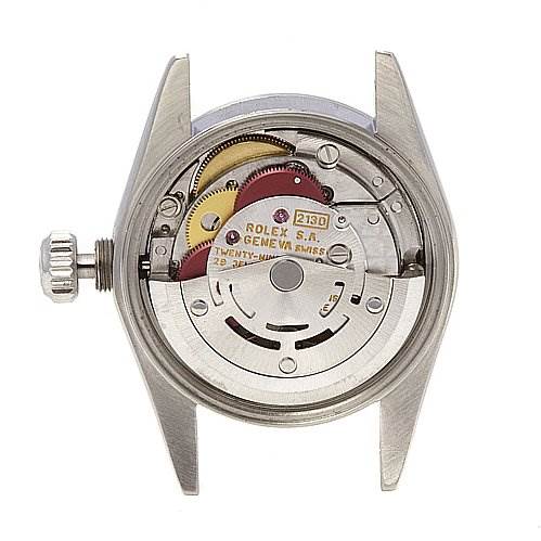 This image shows the movement of a Rolex Oyster Perpetual 67180 Women's Stainless Steel Black Dial 67180 Women's Stainless Steel Black Dial watch, viewed from the back with its inner mechanical parts exposed.