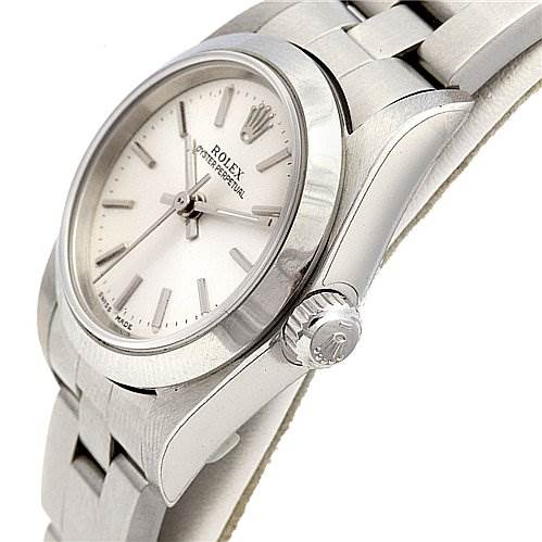 This image shows an angled view of the Rolex Oyster Perpetual 76080 Women's Stainless Steel Silver Dial 76080 Women's Stainless Steel Silver Dial model, highlighting the dial, crown, and part of the bracelet.