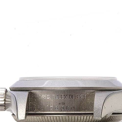 This image shows a side view of a Rolex Oyster Perpetual 76080 Women's Stainless Steel Silver Dial 76080 Women's Stainless Steel Silver Dial watch case, highlighting the crown and the engraved model details.