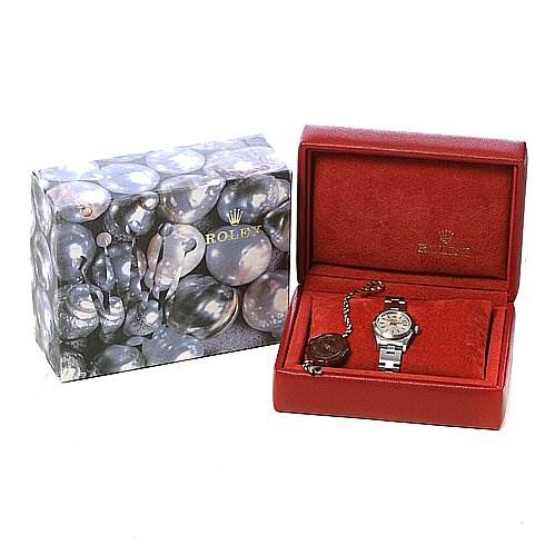 The Rolex Oyster Perpetual 76080 Women's Stainless Steel Silver Dial 76080 Women's Stainless Steel Silver Dial watch is shown in its open red box alongside its outer decorative packaging.