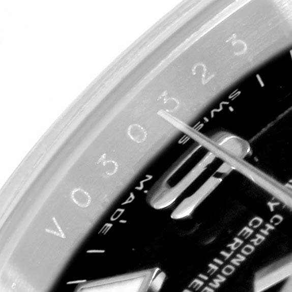 This image shows a close-up view of the dial and the bezel of a Rolex Oyster Perpetual 176200 Women
s Stainless Steel Black Dial 176200 Women
s Stainless Steel Black Dial watch, highlighting the numbers and markers.