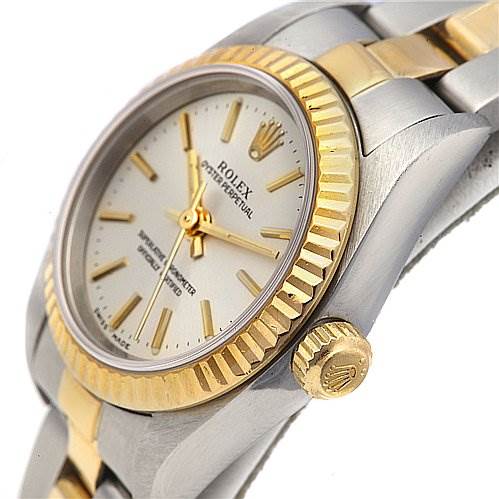 This image shows a close-up side angle of the Rolex Oyster Perpetual 76193 Women's Stainless Steel Silver Dial 76193 Women's Stainless Steel Silver Dial watch, highlighting its bezel, crown, and part of the bracelet.