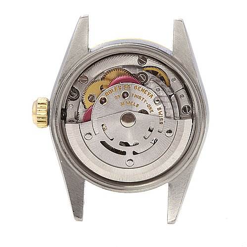 This image shows the back view of the Rolex Oyster Perpetual 76193 Women's Stainless Steel Silver Dial 76193 Women's Stainless Steel Silver Dial watch, displaying the movement and gears inside the case.