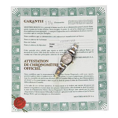 The image shows a Rolex Oyster Perpetual 76193 Women's Stainless Steel Silver Dial 76193 Women's Stainless Steel Silver Dial watch placed on its official chronometer certification and warranty document.
