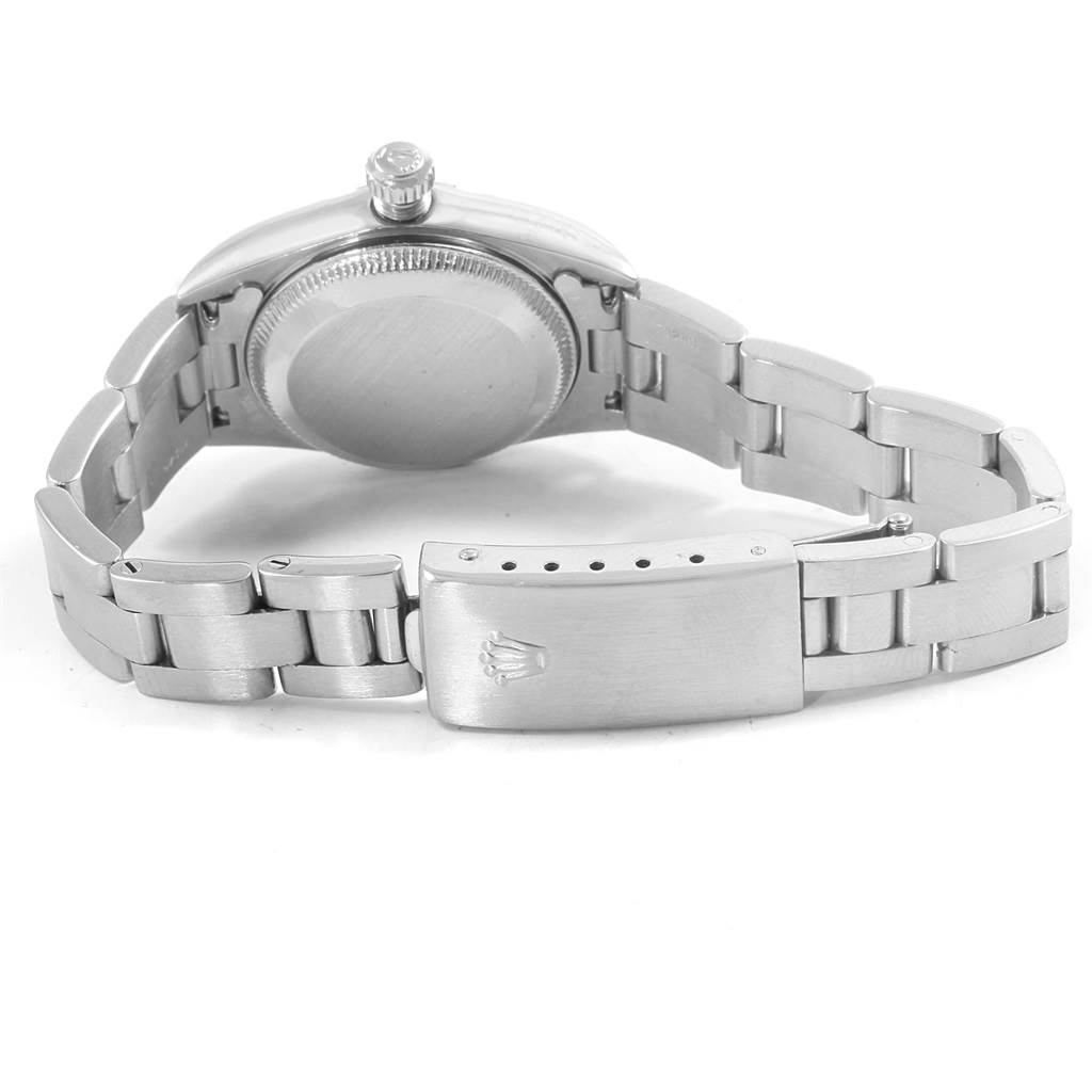 The image shows the back angle of a Rolex Oyster Perpetual 76080 Women's Stainless Steel White Dial 76080 Women's Stainless Steel White Dial watch, highlighting the case back and clasp of the bracelet.