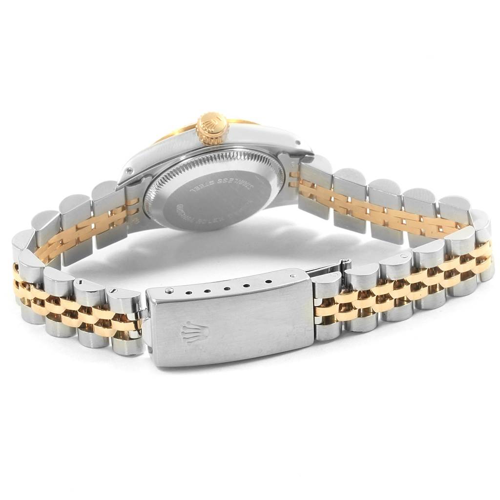 This image shows the back case and bracelet of a Rolex Oyster Perpetual 67193 Women
s Steel and Gold (two tone) White Dial 67193 Women
s Steel and Gold (two tone) White Dial watch, including the clasp and part of the crown.