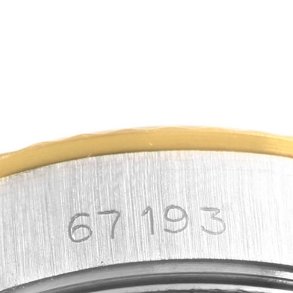 The image shows a close-up of the case back of a Rolex Oyster Perpetual 67193 Women
s Steel and Gold (two tone) White Dial 67193 Women
s Steel and Gold (two tone) White Dial, highlighting the engraved numbers.