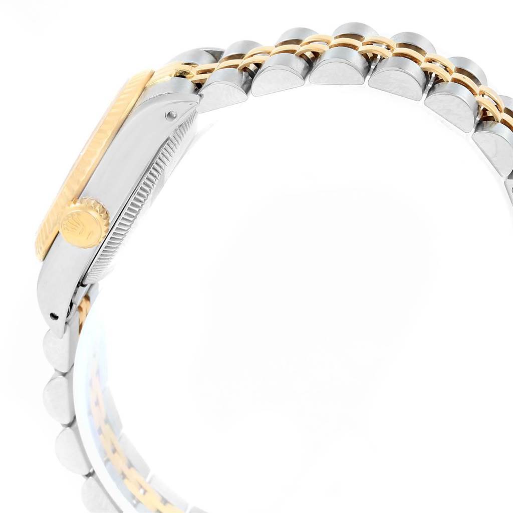 The image shows a side view of the Rolex Oyster Perpetual 67193 Women
s Steel and Gold (two tone) White Dial 67193 Women
s Steel and Gold (two tone) White Dial watch, highlighting the crown, bezel, and the two-tone metal bracelet.