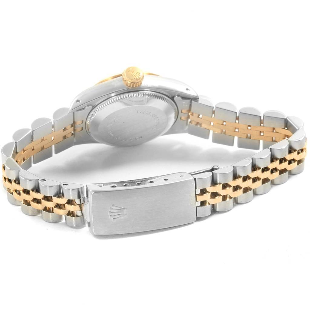 The image shows the back view of the Rolex Oyster Perpetual 67193 Women
s Steel and Gold (two tone) White Dial 67193 Women
s Steel and Gold (two tone) White Dial watch, highlighting its two-tone bracelet and clasp.