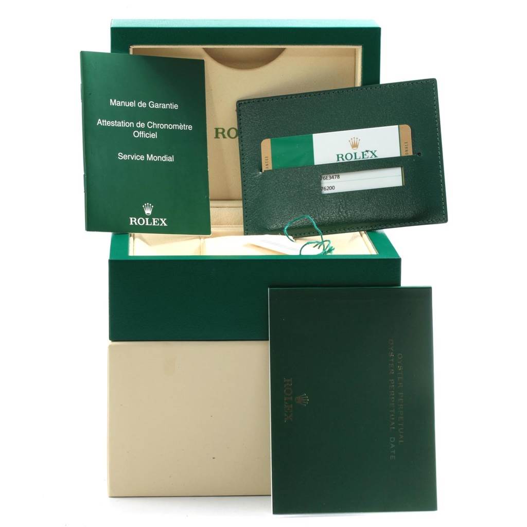 The image shows the packaging and accessories of a Rolex Oyster Perpetual 176200 Women's Stainless Steel Silver Dial 176200 Women's Stainless Steel Silver Dial watch, including the box, warranty card, and manuals.