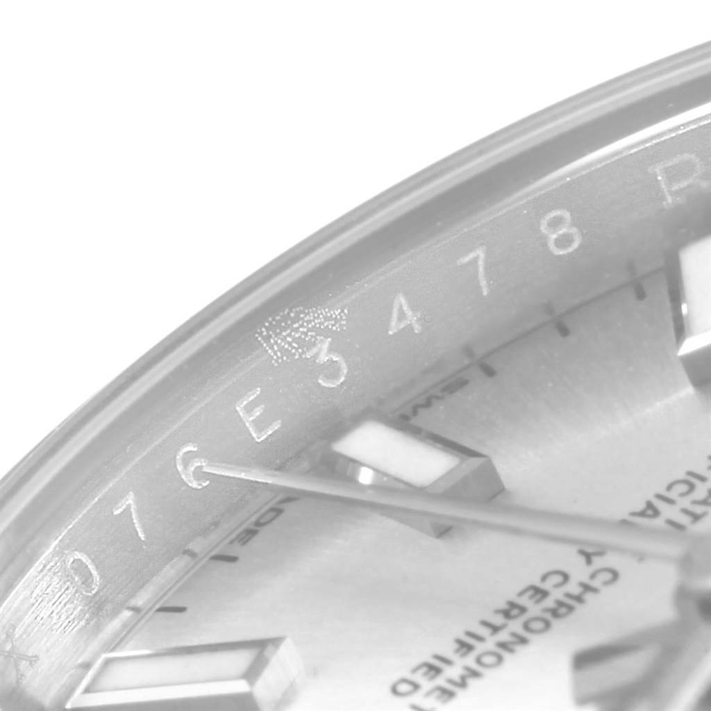 The image shows a close-up of the dial and part of the rehaut of a Rolex Oyster Perpetual 176200 Women's Stainless Steel Silver Dial 176200 Women's Stainless Steel Silver Dial watch, highlighting some engraved numbers and details.