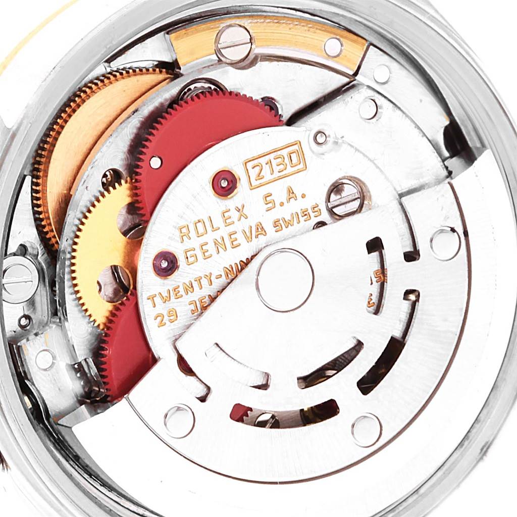 This image shows the internal movement mechanism of the Rolex Oyster Perpetual 67193 Women
s Steel and Gold (two tone) White Dial 67193 Women
s Steel and Gold (two tone) White Dial watch model, highlighting gears and components.