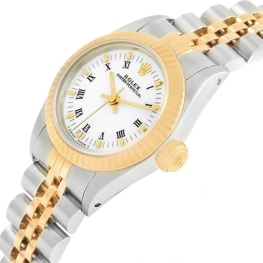 The image shows a side angle view of the Rolex Oyster Perpetual 67193 Women
s Steel and Gold (two tone) White Dial 67193 Women
s Steel and Gold (two tone) White Dial watch, including its bezel, crown, dial, and part of the bracelet.
