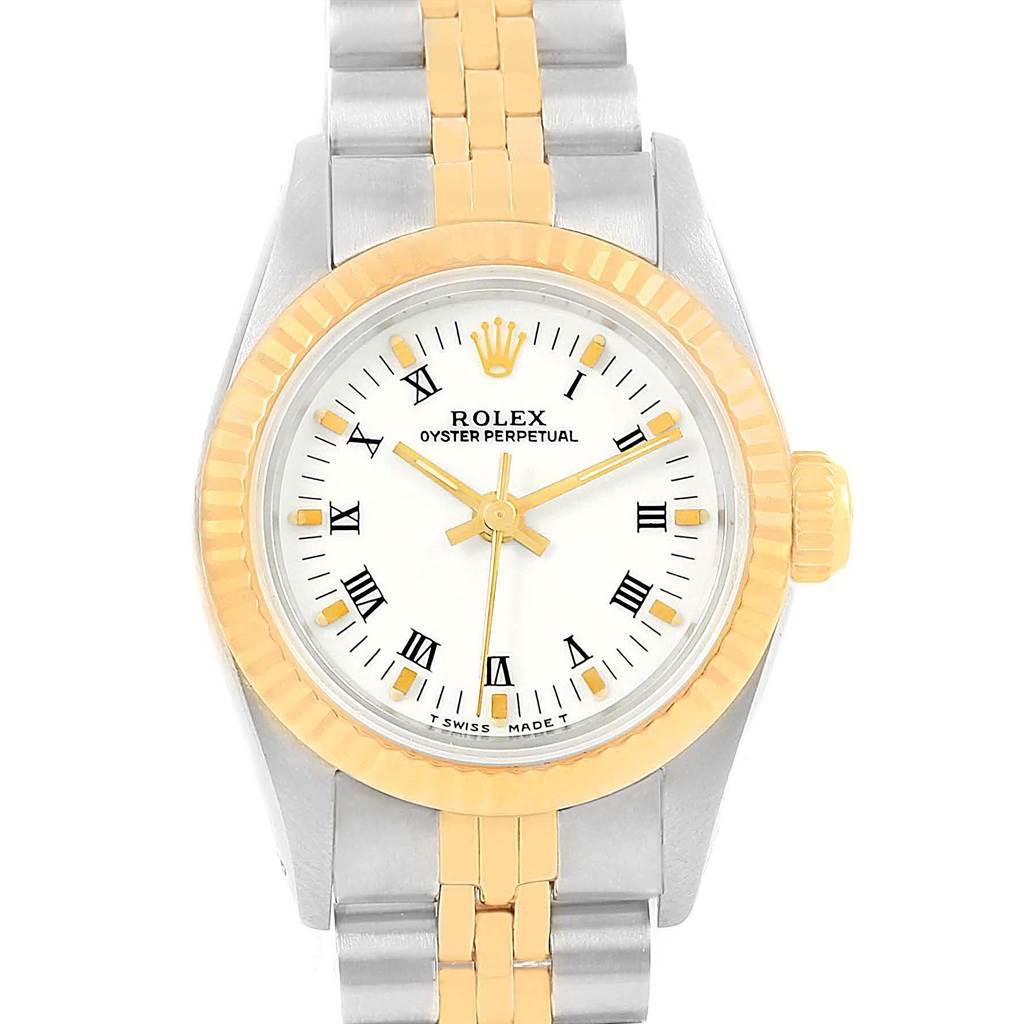 This Rolex Oyster Perpetual 67193 Women
s Steel and Gold (two tone) White Dial 67193 Women
s Steel and Gold (two tone) White Dial watch is shown from a top-down angle, highlighting its face, bezel, crown, and bracelet.