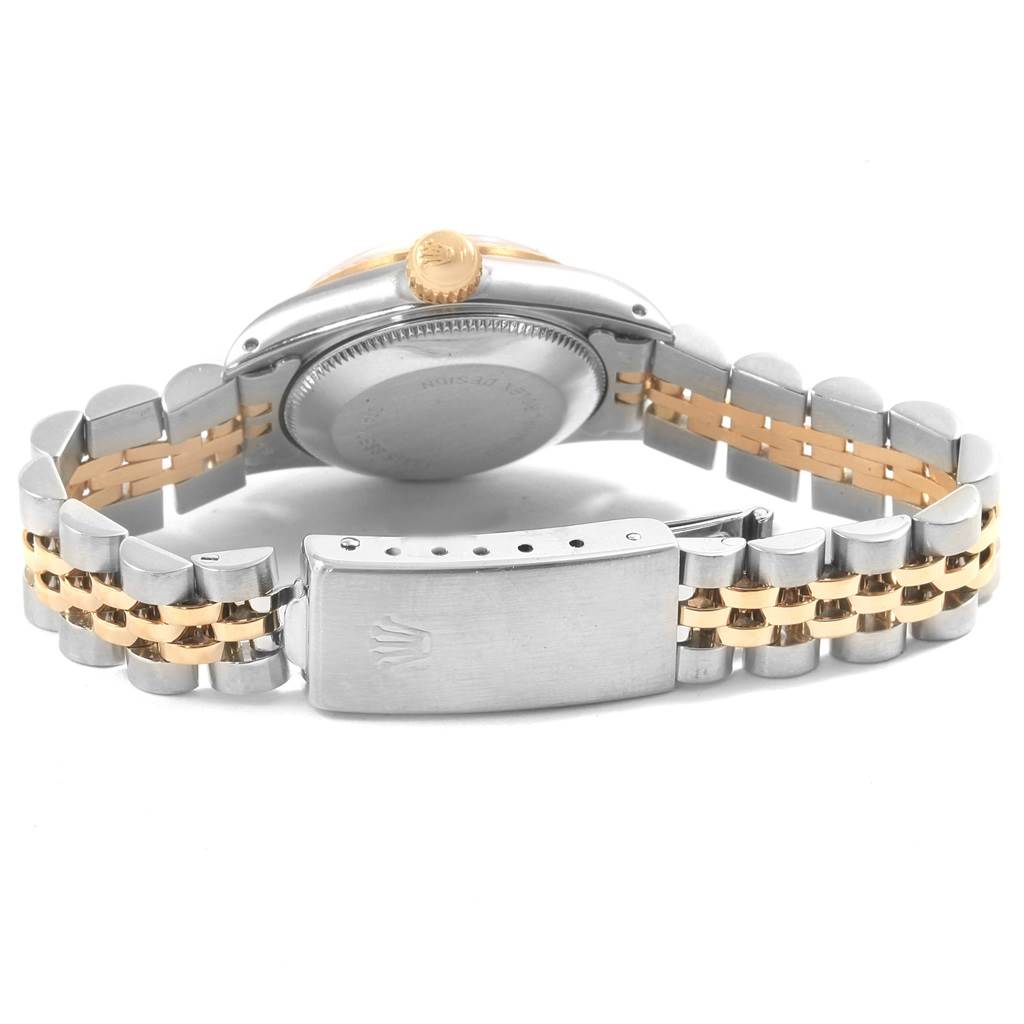 The image shows the back of a Rolex Oyster Perpetual 67193 Women
s Steel and Gold (two tone) White Dial 67193 Women
s Steel and Gold (two tone) White Dial watch, focusing on the case back and two-tone bracelet with clasp.