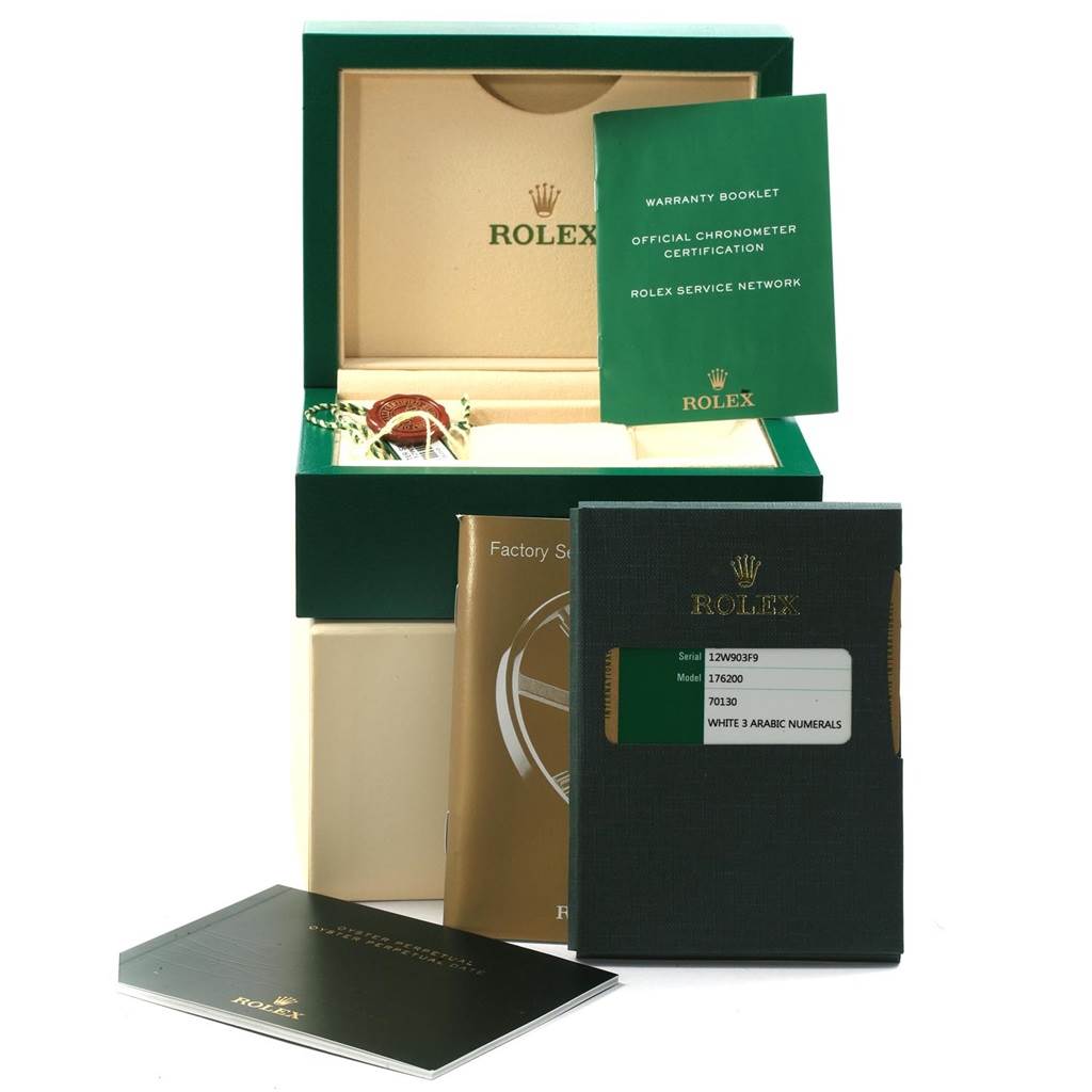 This image shows the packaging, warranty booklets, and official certification papers for a Rolex Oyster Perpetual 176200 Women
s Stainless Steel White Dial 176200 Women
s Stainless Steel White Dial model watch.