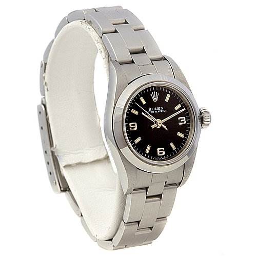 The Rolex Oyster Perpetual 67180 Women's Stainless Steel Black Dial 67180 Women's Stainless Steel Black Dial watch is shown at a slight angle, displaying the face, bezel, bracelet, and crown.