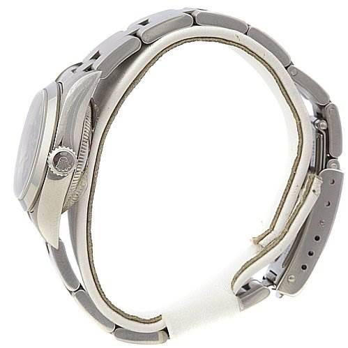 The image shows a side profile of a Rolex Oyster Perpetual 67180 Women's Stainless Steel Black Dial 67180 Women's Stainless Steel Black Dial watch, highlighting the crown and bracelet.