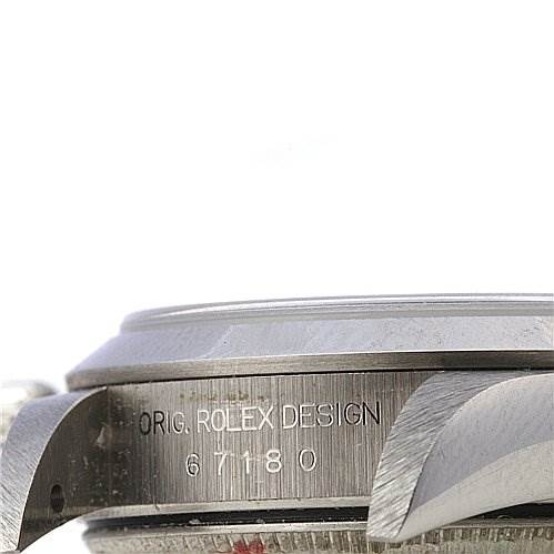 The image shows a side view of the case and bezel of a Rolex Oyster Perpetual 67180 Women's Stainless Steel Black Dial 67180 Women's Stainless Steel Black Dial watch, with the model number and "Orig. Rolex Design" engraved.