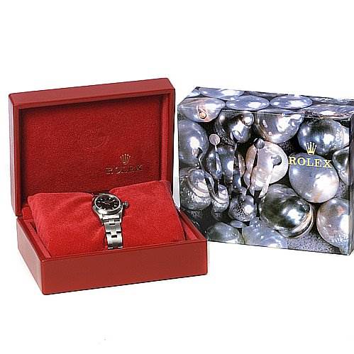 The image shows a Rolex Oyster Perpetual 67180 Women's Stainless Steel Black Dial 67180 Women's Stainless Steel Black Dial watch in a red display box with a separate decorative Rolex box in the background.