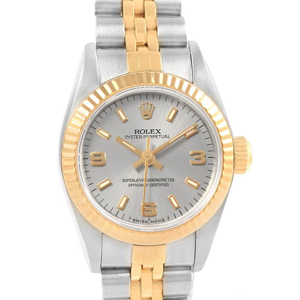 This Rolex Oyster Perpetual 67193 Women's Steel and Gold (two tone) Grey Dial 67193 Women's Steel and Gold (two tone) Grey Dial watch is shown from a frontal angle, displaying its dial, bezel, crown, and part of the bracelet.