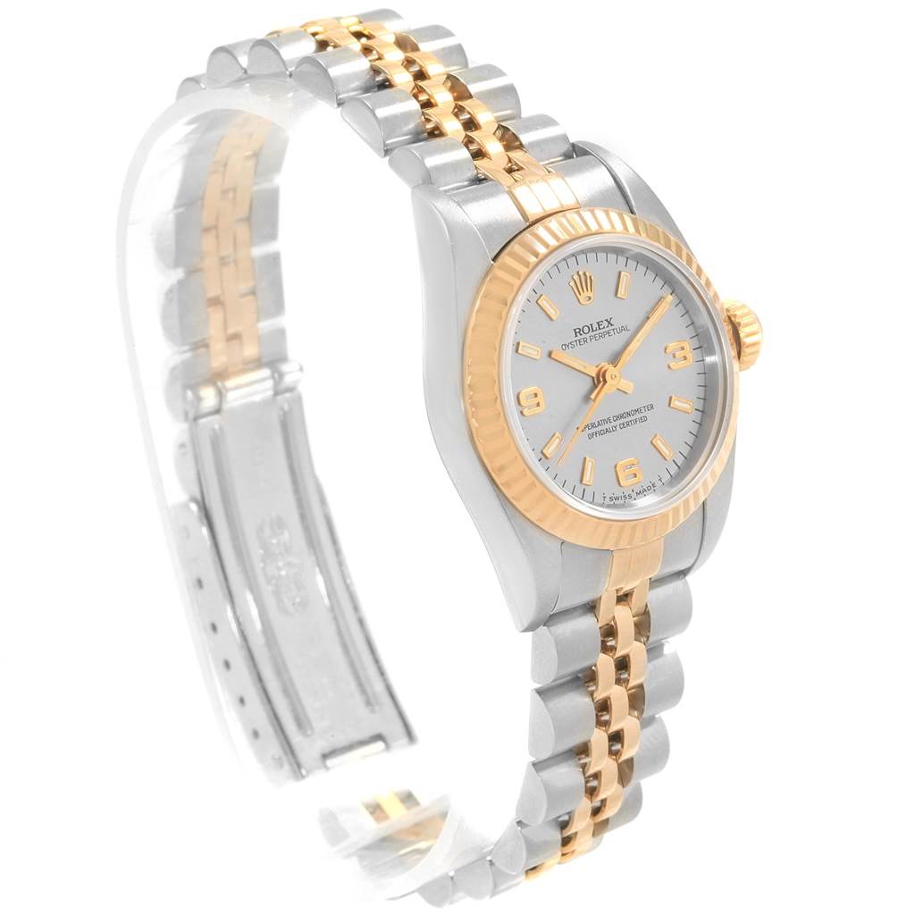 The image shows a side angle of a Rolex Oyster Perpetual 67193 Women's Steel and Gold (two tone) Grey Dial 67193 Women's Steel and Gold (two tone) Grey Dial watch, highlighting the bracelet, case, dial, and crown.