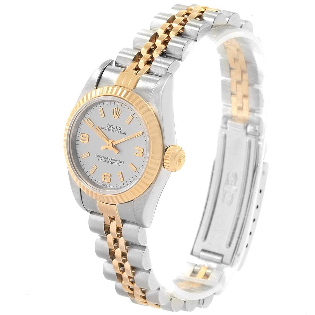 The image shows a side angle of a Rolex Oyster Perpetual 67193 Women's Steel and Gold (two tone) Grey Dial 67193 Women's Steel and Gold (two tone) Grey Dial watch highlighting its bezel, dial, crown, and two-tone metal bracelet.