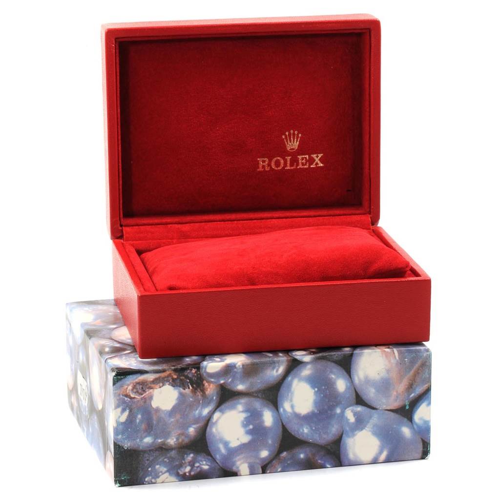 The image shows an open Rolex Oyster Perpetual 67193 Women's Steel and Gold (two tone) Grey Dial 67193 Women's Steel and Gold (two tone) Grey Dial watch box with red interior and a decorative outer box.