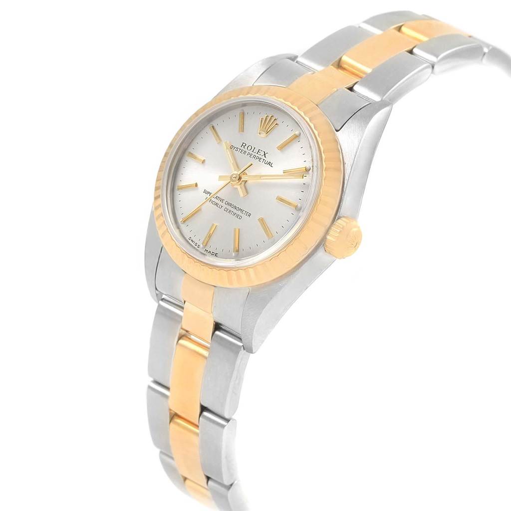 The Rolex Oyster Perpetual 76193 Women's Steel and Gold (two tone) Silver Dial 76193 Women's Steel and Gold (two tone) Silver Dial model watch is shown at a three-quarter angle, highlighting its two-tone bracelet, dial, and crown.