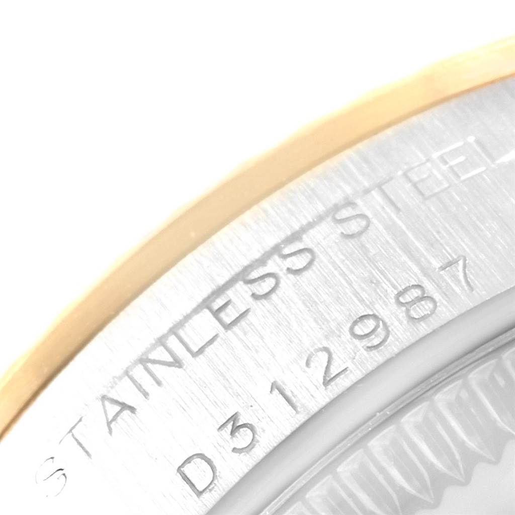 This close-up angle shows the stainless steel part and serial number engraving on a Rolex Oyster Perpetual 76193 Women's Steel and Gold (two tone) Silver Dial 76193 Women's Steel and Gold (two tone) Silver Dial watch.