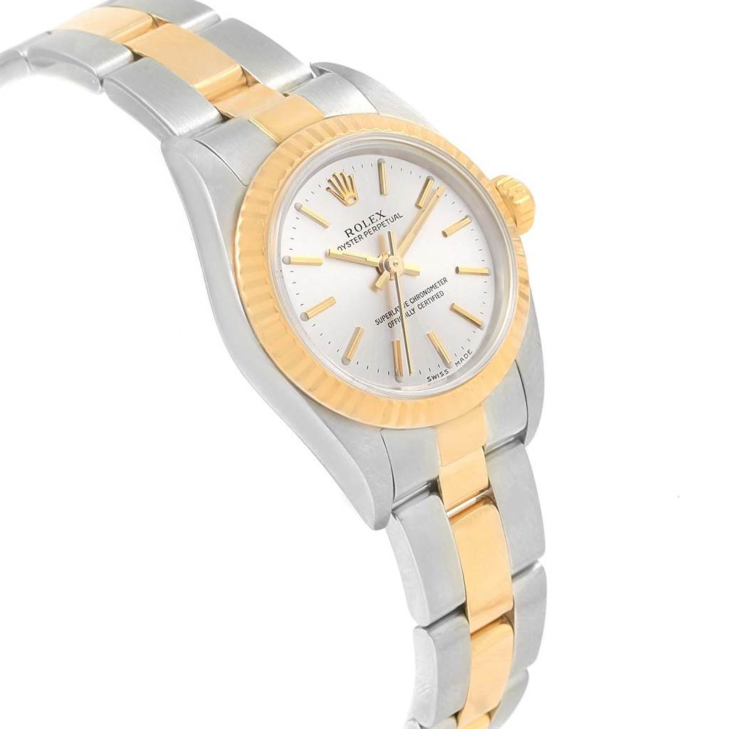 This image shows a side angle of a Rolex Oyster Perpetual 76193 Women's Steel and Gold (two tone) Silver Dial 76193 Women's Steel and Gold (two tone) Silver Dial watch, highlighting the dial, bezel, and bracelet.