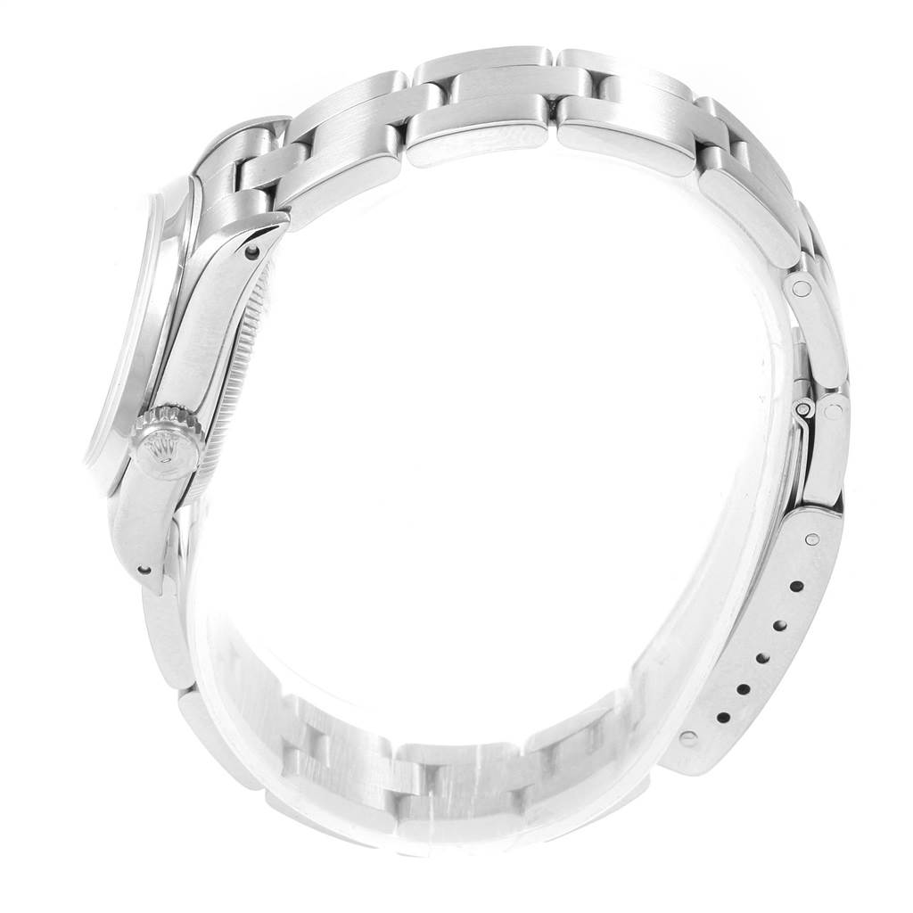 The image shows a side view of a Rolex Oyster Perpetual 67180 Women's Stainless Steel White Dial 67180 Women's Stainless Steel White Dial watch, focusing on the crown, case, and bracelet.