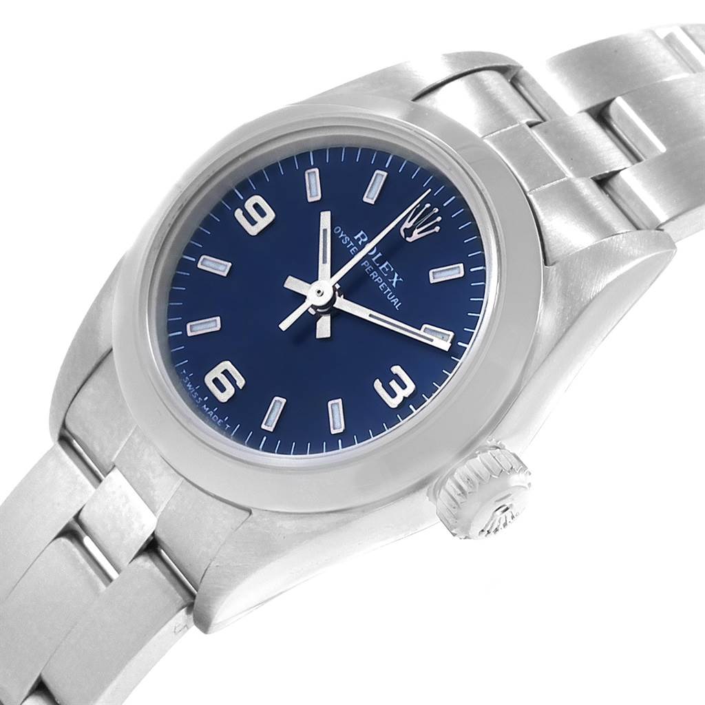 The Rolex Oyster Perpetual 67180 Women's Stainless Steel Blue Dial 67180 Women's Stainless Steel Blue Dial watch is shown from an angled view, highlighting the blue dial, stainless steel case, and bracelet.