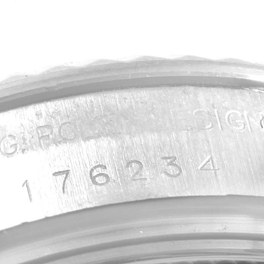 This image shows a close-up of the engraved serial number on the case of a Rolex Oyster Perpetual 176234 Women's Stainless Steel  176234 Women's Stainless Steel  watch.