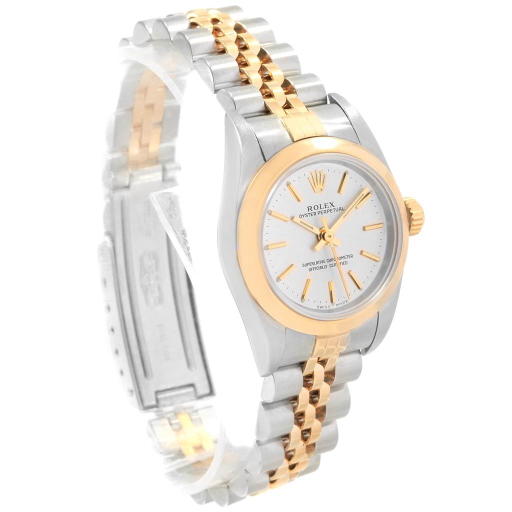 This image shows a Rolex Oyster Perpetual 76183 Women's Steel and Gold (two tone) Silver Dial 76183 Women's Steel and Gold (two tone) Silver Dial watch at a three-quarter angle highlighting the dial, bezel, crown, and bracelet.